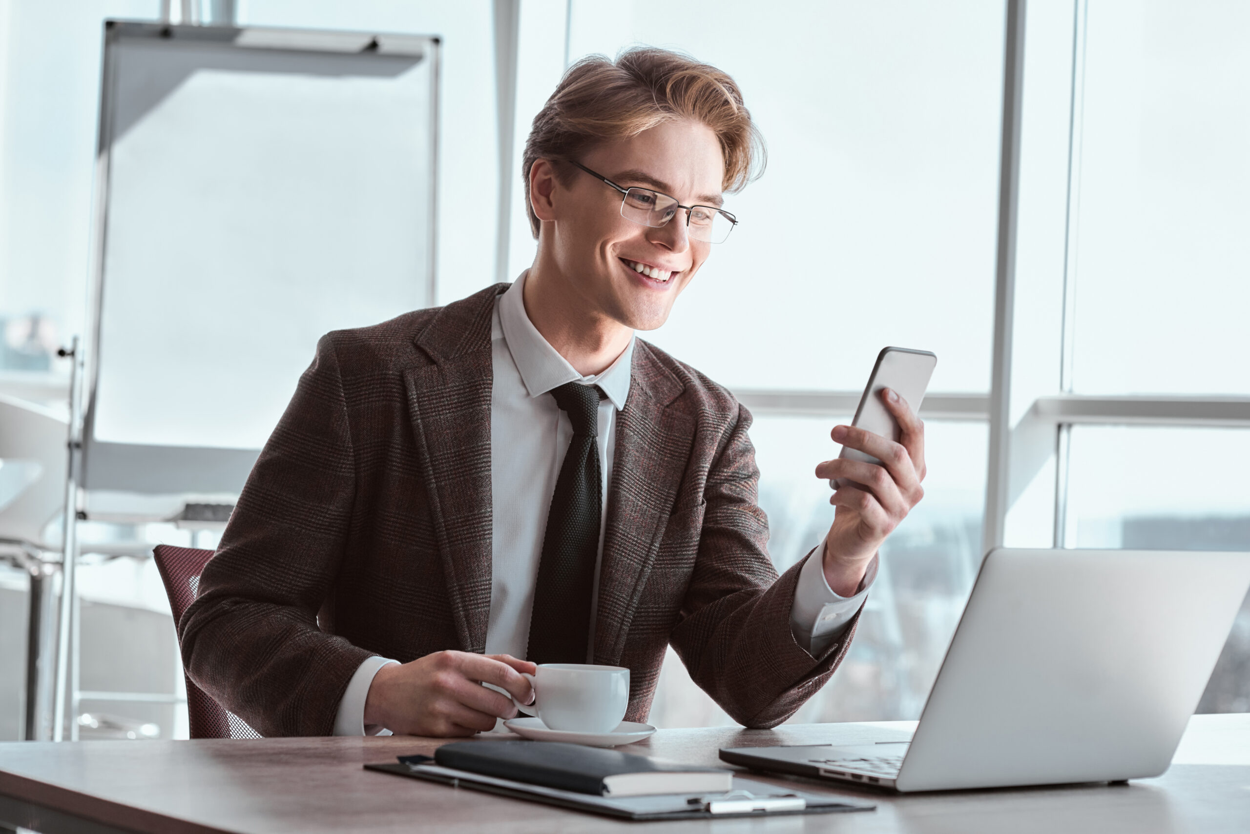 young_businessman_in_eyeglasses_at_office_sitting_2023_11_27_05-scaled